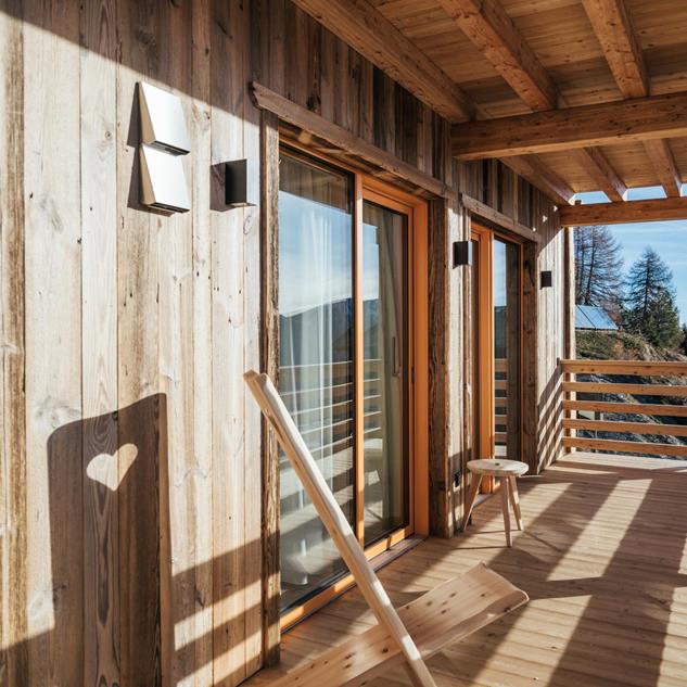 Bright and sunny wooden terrace of a chalet.