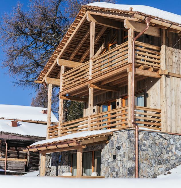Holzchalet Ciasa Arnica im Schnee