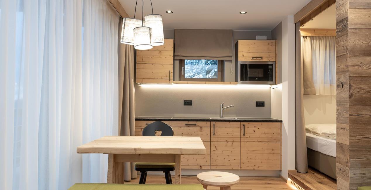 The living and dining room of Ciasa Rosina